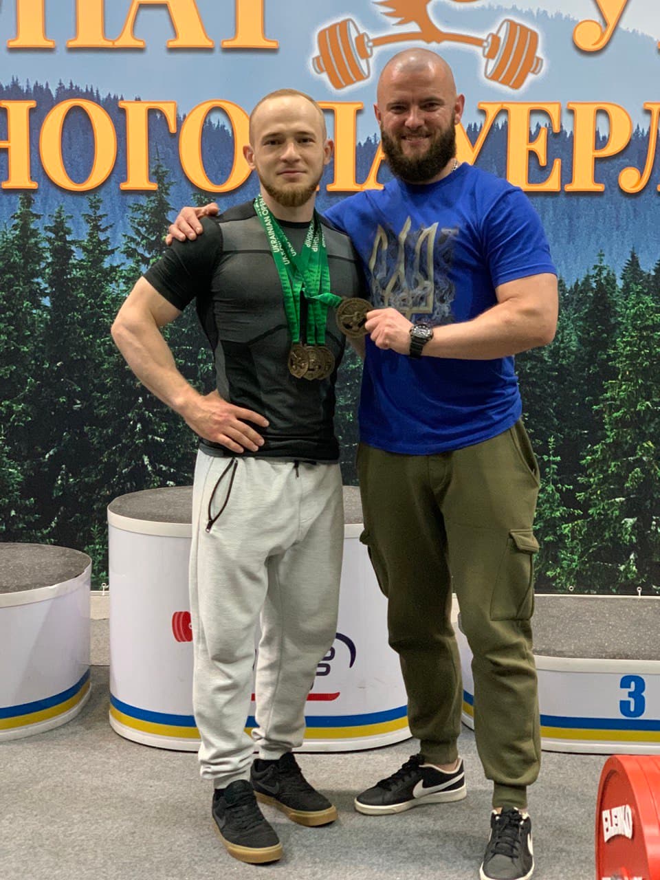 Wearing medals from a national powerlifting championship